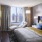 a bedroom with a bed and a chair