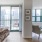 a bedroom with a large glass door